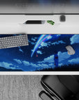 36x16 inches anime desk pad in deep navy with neon blue and pink comet streaks, calm dreamy vibe.
