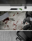 Dark and intense 40x20 inch anime desk pad showcasing Guts in fearsome Berserker Armor for gritty visual lovers