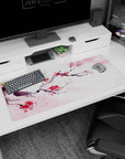 Artistic 36x16 inches desk pad featuring watercolor cherry branches, blending soft pink and red petals to evoke the calmness of spring and nature.
