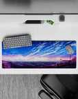32x12 inches anime desk mat in cotton-candy sunrise and deep ocean blues, calm dreamy sky and clouds.