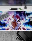 40x20 inches desk pad showcasing Goku’s Ultra Instinct transformation, radiating intense blue and white energy for an epic design.