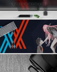 Dynamic 40x20 desk pad showcases Hiro and Zero Two's intense connection with symbolic unity design for fans