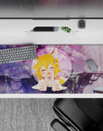 Cozy pastel anime desk pad 36x16 inches in dreamy purples and pink sakura tones, soft vibe.