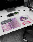 Shy anime girl with dark bob and rosy cheeks under drifting cherry blossoms desk pad 36x16 inches.