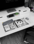 32x12 inches Komi Can’t Communicate mouse pad featuring Shouko Komi wide-eyed, hand-to-mouth gasp.