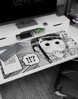 40x20 inches Shouko Komi desk pad, wide eyes and hand-to-mouth gasp in crisp monochrome line art.