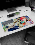 32x16 inches anime mouse pad showing snow-haired swordswoman crouched, horned redhead grinning behind.