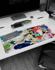 36x16 inches anime desk pad showing snow-haired swordswoman crouched, red-haired horned ally behind.