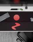 Mysterious 40x20 desk pad with a glowing red sun, deep mountain shadows, and calm waters, creating a serene and peaceful workspace vibe
