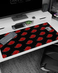 Naruto Shippuden Akatsuki symbols desk pad 40x20 inches, repeating red cloud emblems on black.