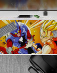 Dynamic 40x20 inch anime desk pad showcasing the intense showdown and bold colors of Gogeta vs Janemba