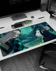 Anime desk pad 40x20 inches featuring Tanjiro and Nezuko from Demon Slayer, with a soft glow and fireflies in blues and greens.