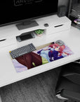 Red-haired anime girl lounging on soft bedding with headphones at her neck mouse pad 28x12 inches.