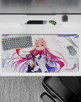 Dynamic 32x16 mouse pad featuring Zero Two’s emerald eyes, flowing pink hair, and windswept background for powerful presence