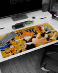 Haikyuu Hinata diving for the winning point on a 40x20 inches desk pad, teammates behind, volleyballs flying.