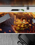 Anime mouse pad 40x20 inches featuring Tanjiro Kamado in action with fiery arcs, perfect for Demon Slayer fans.