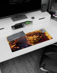 Anime mouse pad 28x12 inches featuring Tanjiro Kamado mid-strike, engulfed in fiery orange arcs against a dark blue night.