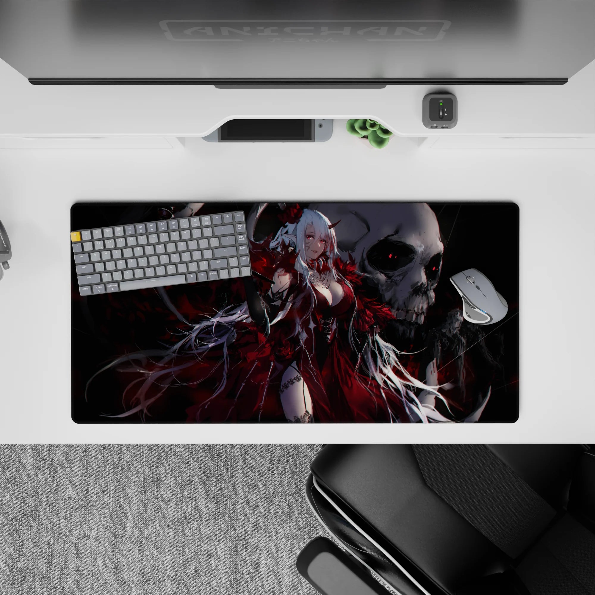 Gothic crimson anime mouse pad 32x16 inches in smoky black and silver with skull backdrop.