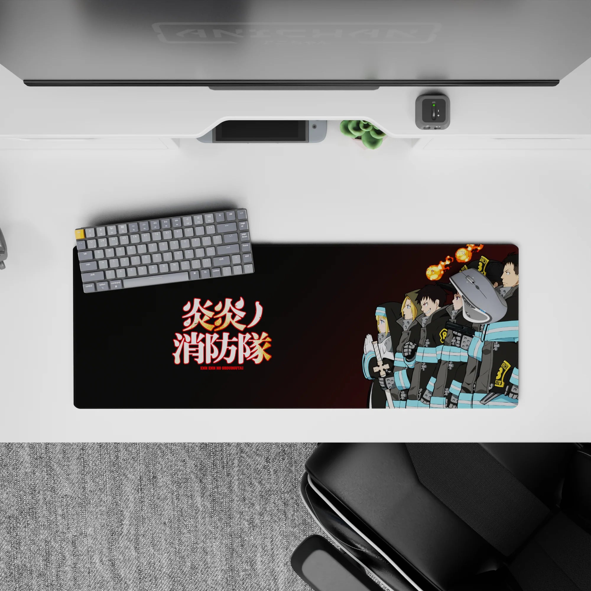 Black-coat Fire Force mouse pad 32x12 inches with turquoise bands, glowing kanji, warm ember tones.