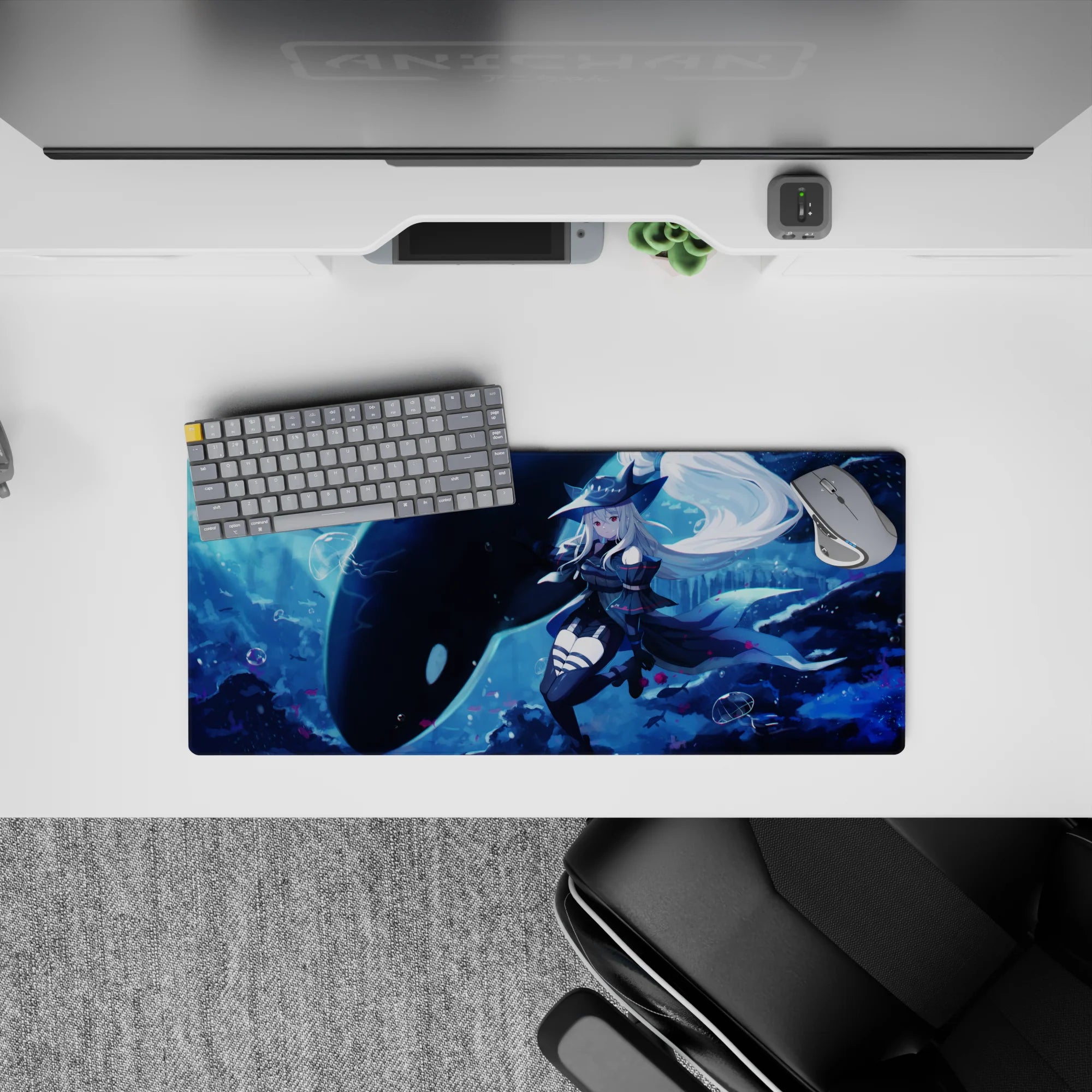 28x12 inches anime desk mouse pad in deep ocean blues with icy glow, bubbles, and soft pink petals.