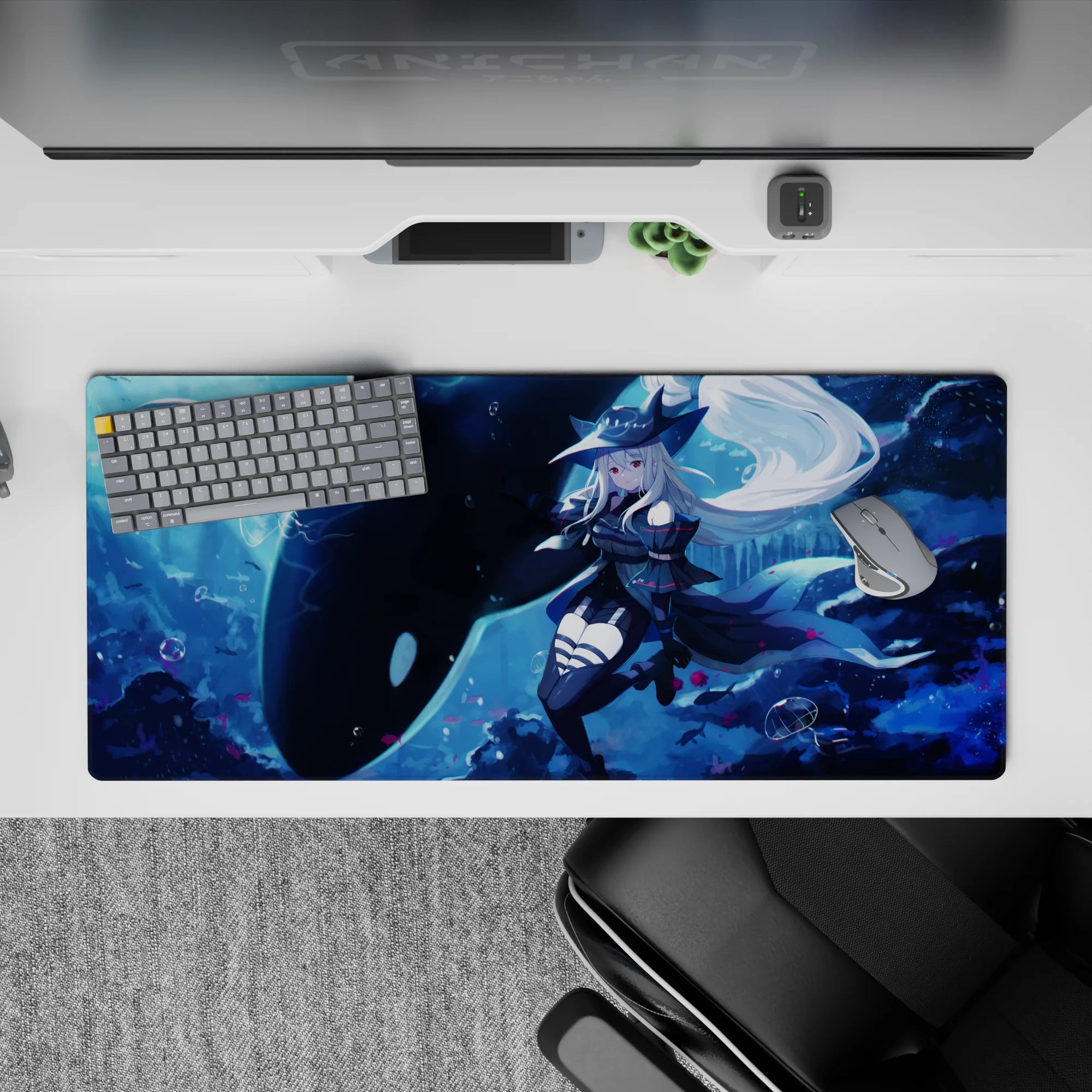 36x16 inches anime girl desk pad in deep blues with icy glow, bubbles, pink petals, dreamy mood.