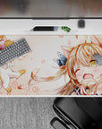 Cozy chaos anime desk pad 40x20 inches in warm peach and cream tones with soft blush doodles.
