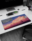 32x16 inches mouse pad with lone anime girl gazing at the sky under soft sunset clouds and sparks.