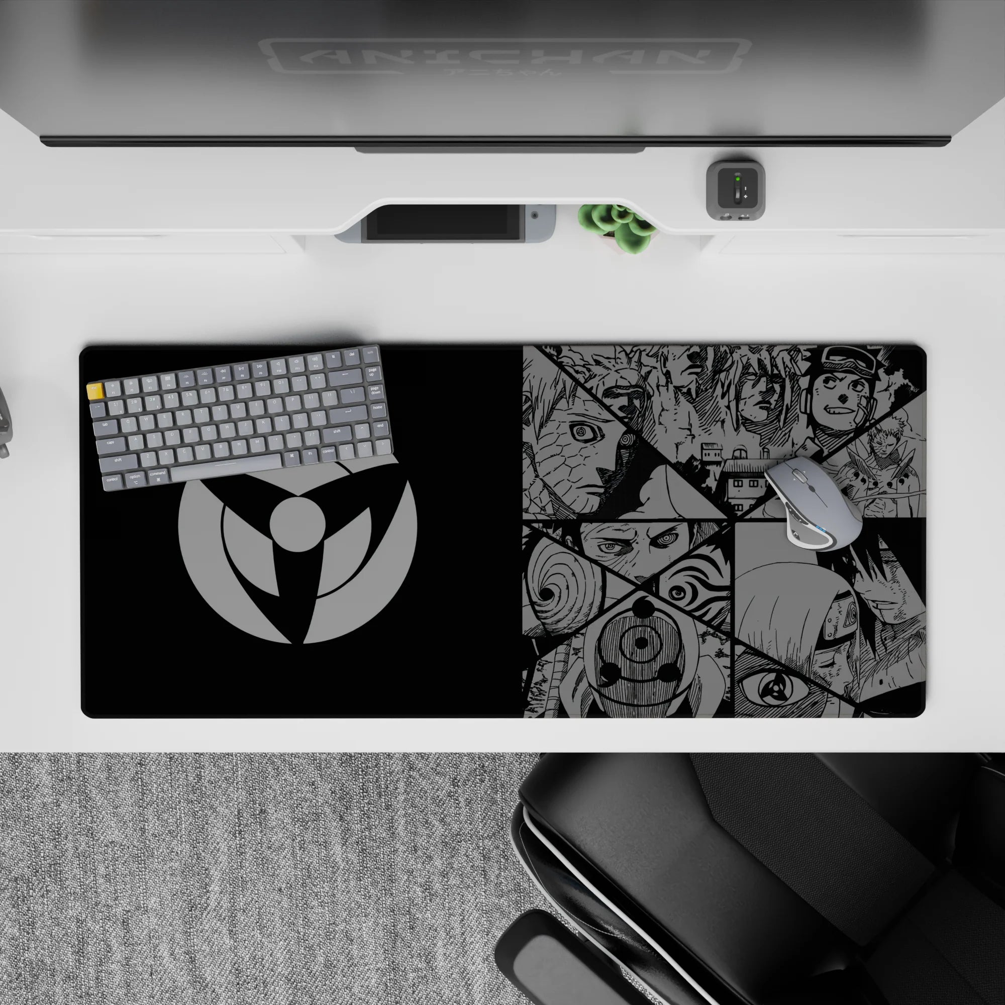 Black and steel-gray anime desk pad 36x16 inches with crisp manga collage, tense Sharingan mood, clean setup look.
