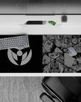 Black and steel-gray anime desk pad 36x16 inches with crisp manga collage, tense Sharingan mood, clean setup look.