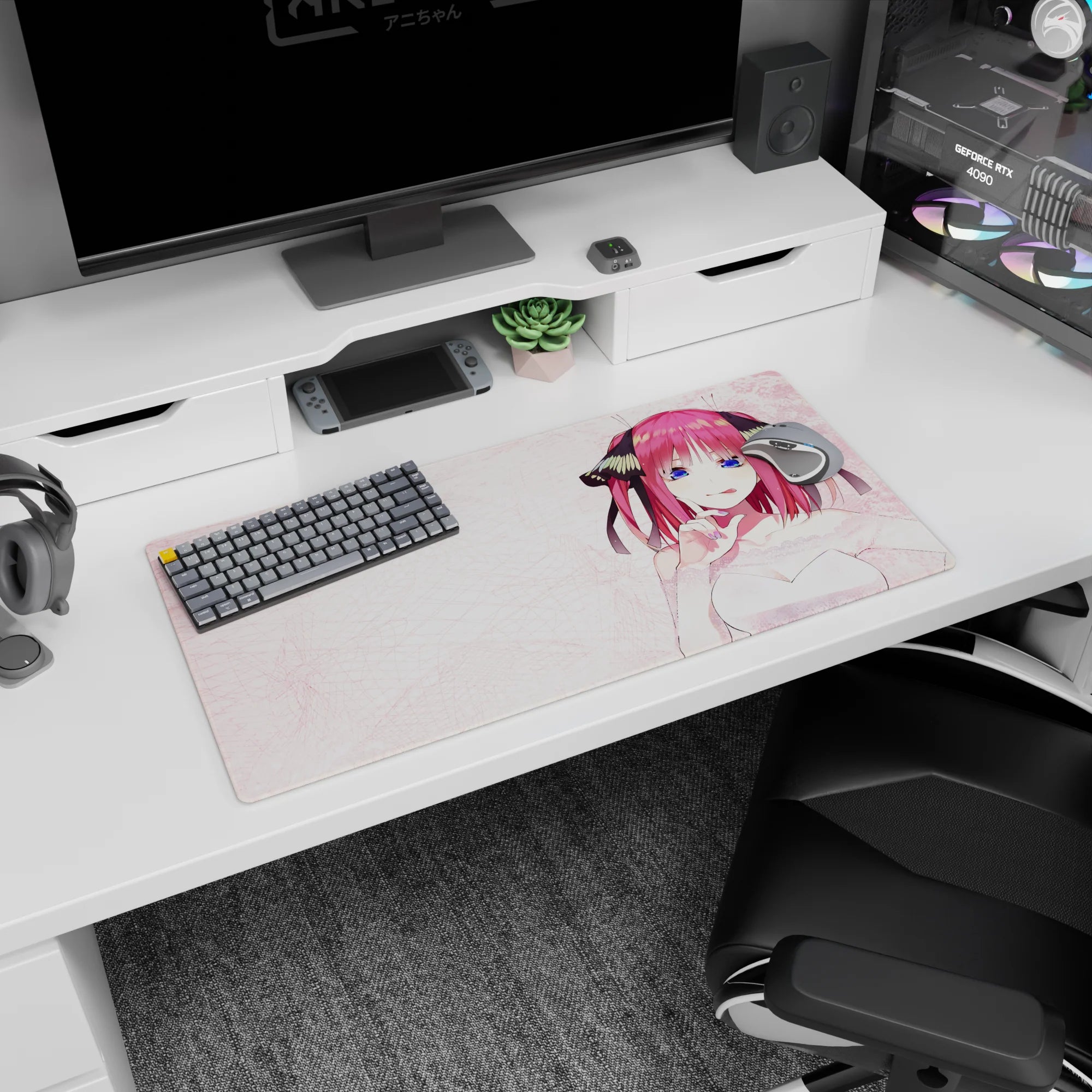 32x16 inches Nino Nakano mouse pad from The Quintessential Quintuplets, mischievous smile on a pink desk.