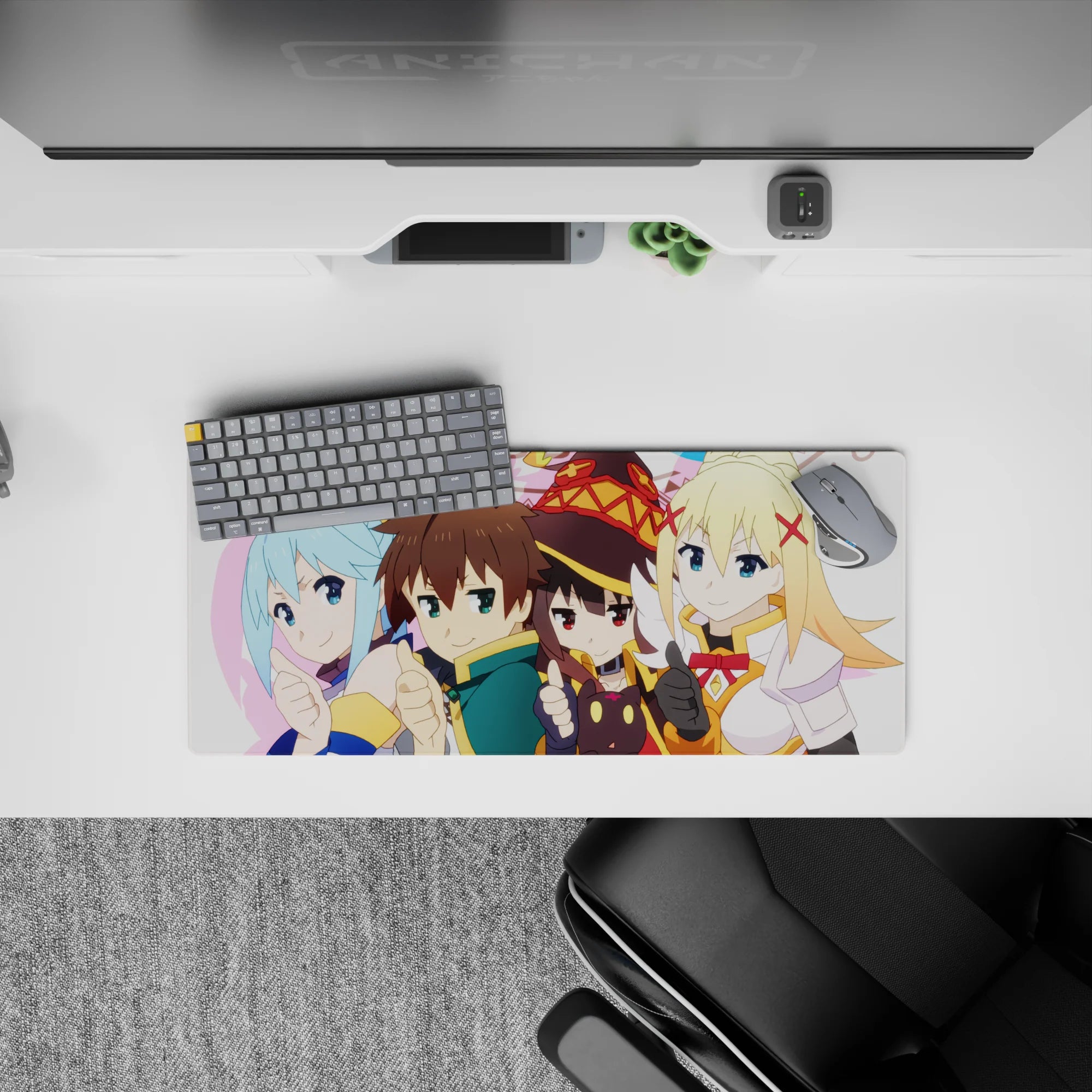 Kazuma and KonoSuba crew on 28x12 inches anime mouse pad, chibi style, bright colors, Aqua, Megumin, Darkness featured.