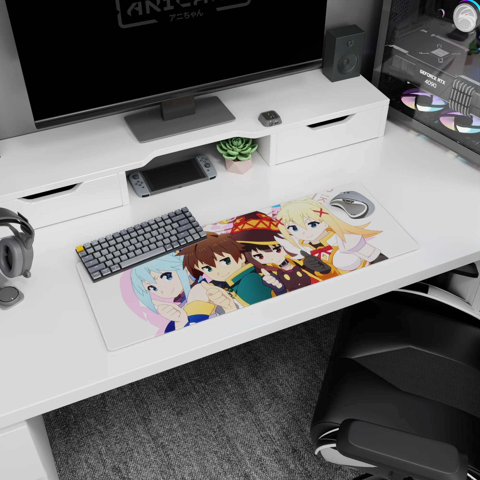 KonoSuba anime mouse pad 32x12 inches featuring chibi Kazuma, Aqua, Megumin, and Darkness in a vibrant, playful design.