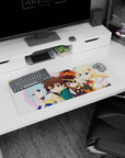 KonoSuba anime mouse pad 32x12 inches featuring chibi Kazuma, Aqua, Megumin, and Darkness in a vibrant, playful design.