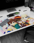Kazuma and KonoSuba crew on 40x20 inch anime desk pad; vibrant chibi style with Aqua, Megumin, and Darkness.