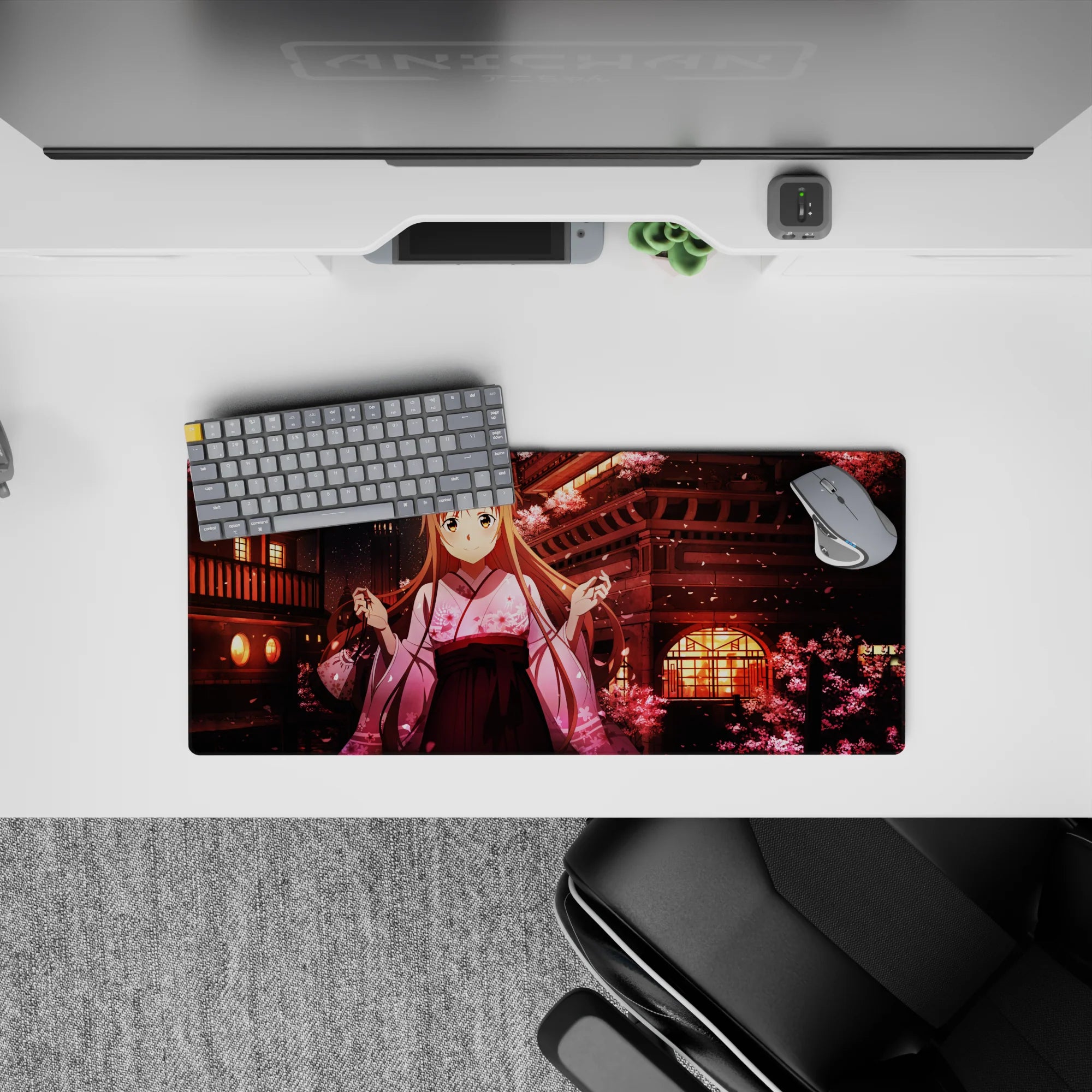 Mouse pad featuring Asuna from Sword Art Online amidst blooming sakura, lanterns; 28x12 inches, enhances desk decor.