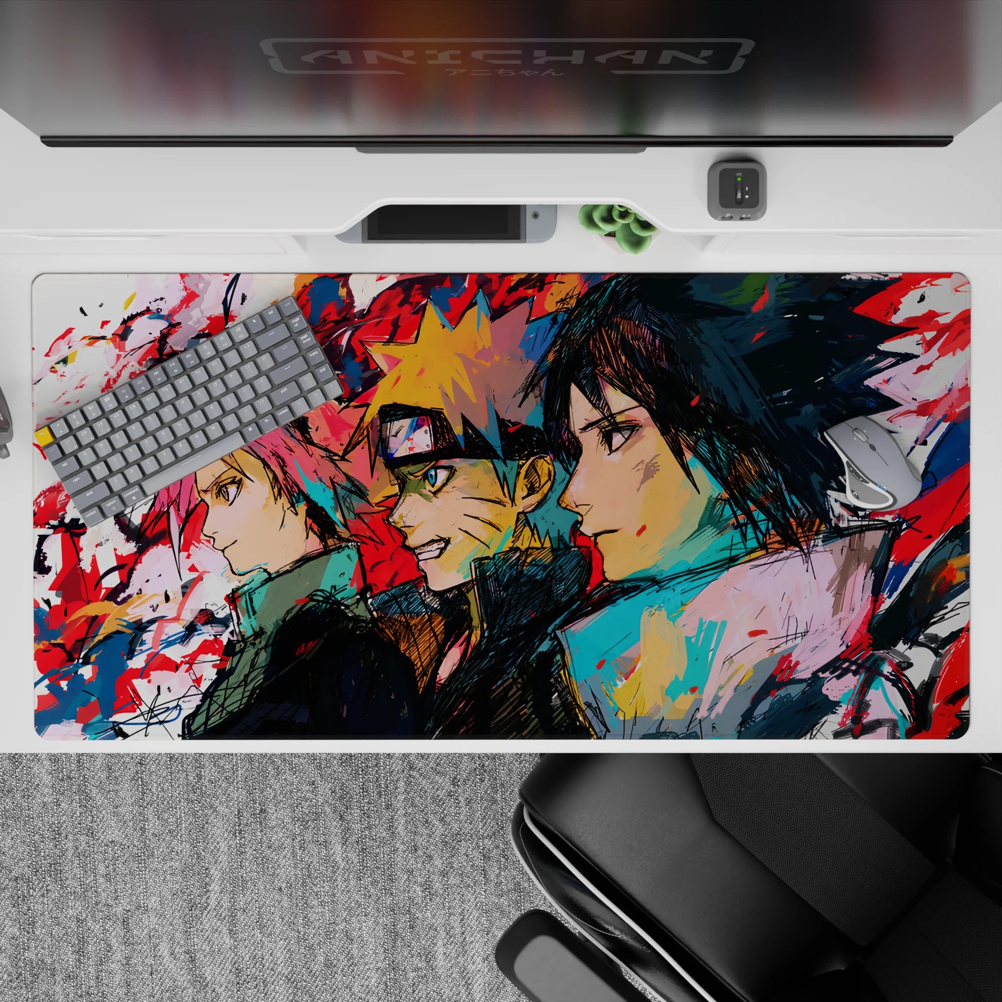Anime desk pad 40x20 inches featuring Team 7—Sakura, Naruto, Sasuke—in dynamic sketch-art; vibrant colors and textures.
