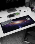 Night sky scene desk pad 36x16 inches featuring a glowing galactic core and star-sprinkled swirl.