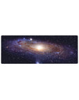 Galaxy swirl starry desk mouse pad, 32x12 inches, with glowing core and cosmic ribbon bands.