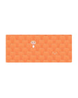 28x12 inches anime mouse pad with repeating orange hamsters and a grinning girl popping up on desk.