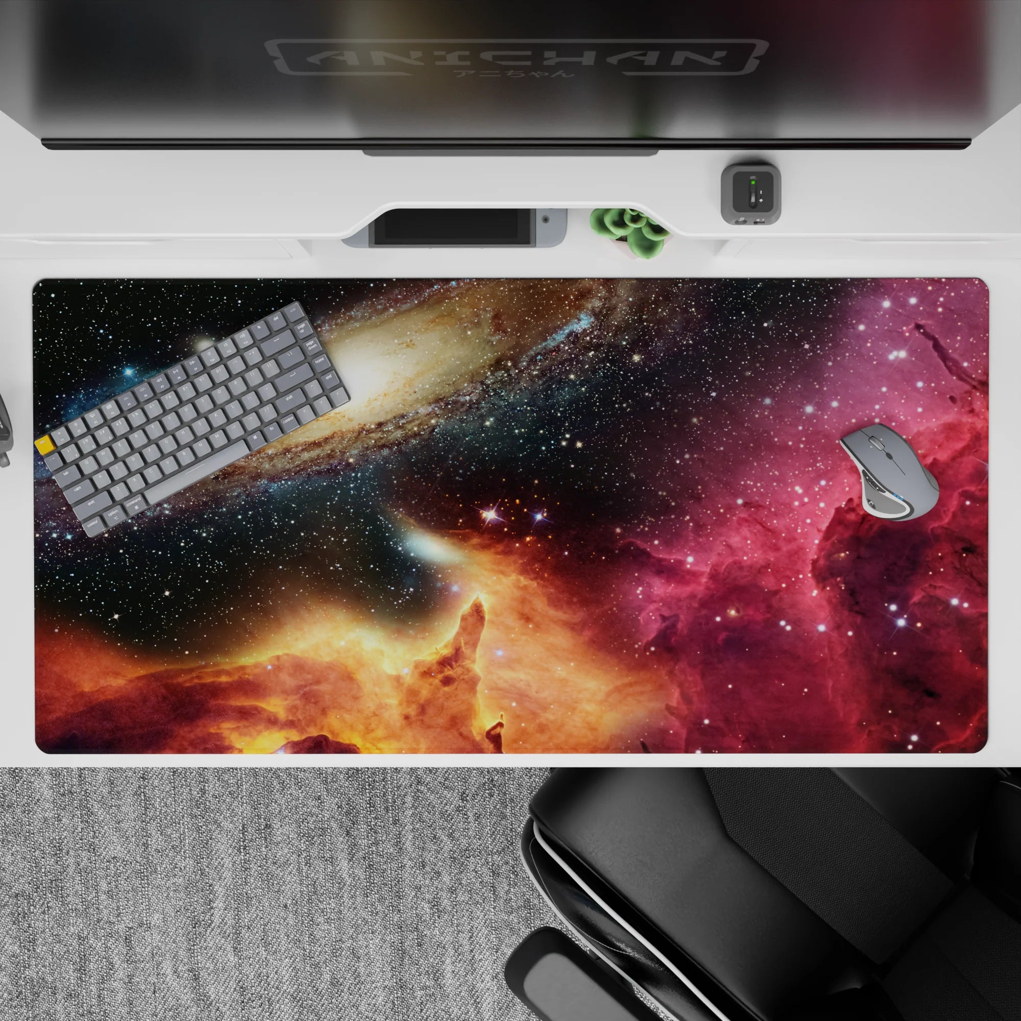 Deep navy and black 40x20 inches desk pad with magenta nebula haze and warm golden glow, calming cosmic mood.