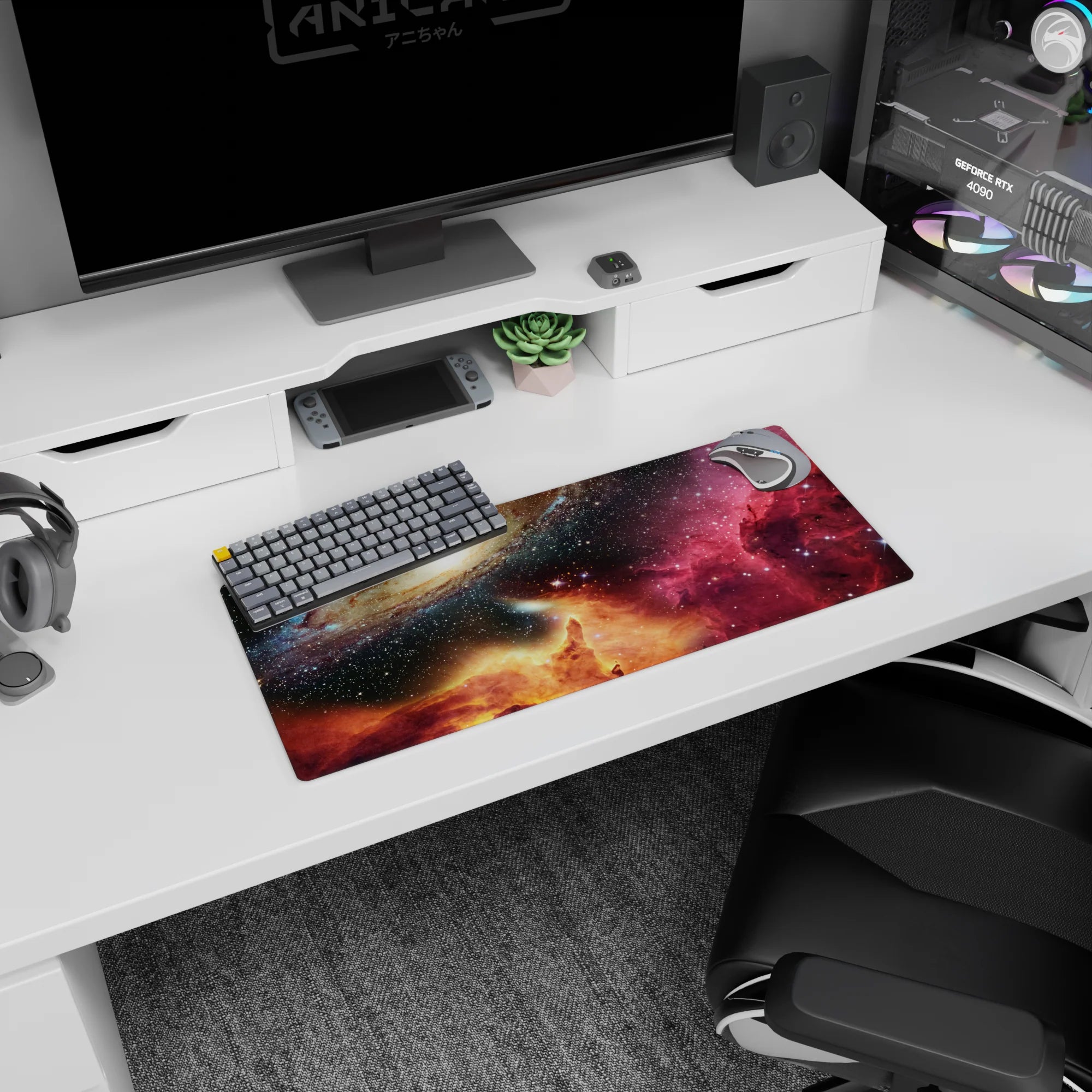 Spiral galaxy scene mouse pad 28x12 inches featuring a drifting nebula sky over a glowing horizon.
