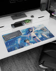 32x16 inches anime mouse pad featuring girl in white sleeveless hoodie and boy smiling, towers behind.