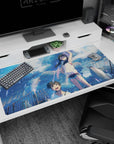 40x20 inches anime desk pad showing laughing teen girl in white hoodie and boy smiling under storm clouds.