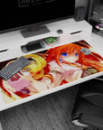 Orange-haired mage girl with big blue eyes casting golden spiral magic on a 40x20 inches anime desk pad.