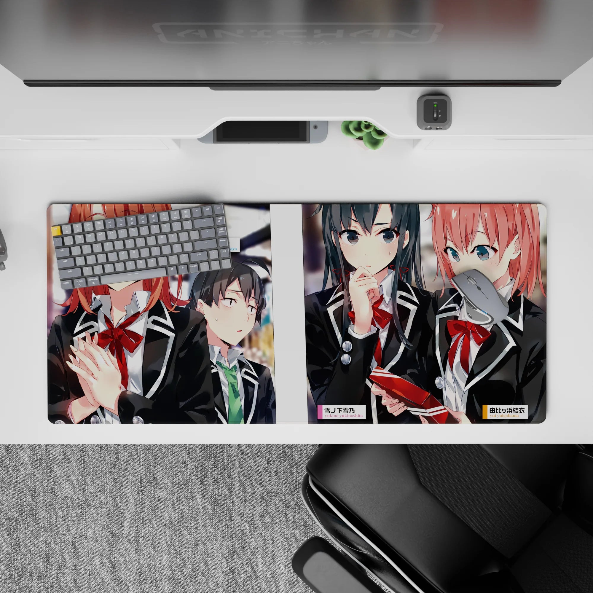 Anime girl desk pad 36x16 inches in black, warm skin tones and glossy red accents with soft hallway blur.