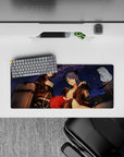 28x12 inches anime girl mouse pad in deep navy with punchy red accents, cozy chaos vibe, soft gradients.