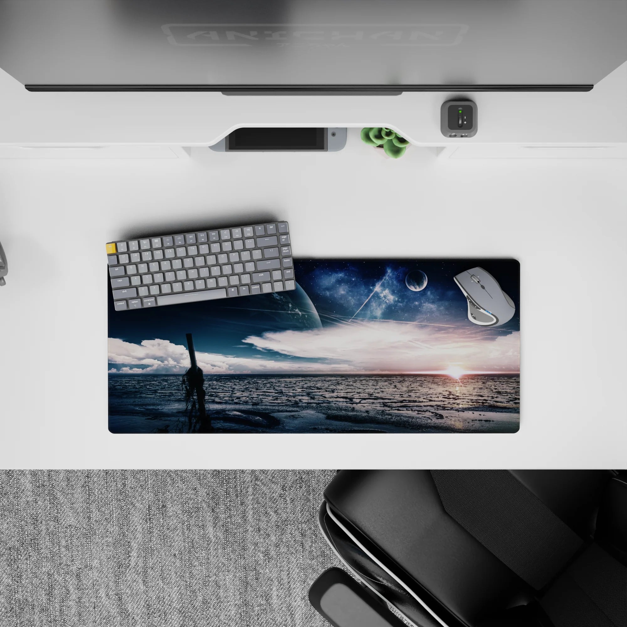 Moody navy and deep blue mouse pad, 28x12 inches, with silvery stars and a warm sunrise glow.