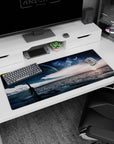 Giant planet over a calm sea desk pad 36x16 inches, starry night sky and glowing horizon.