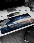 Giant planet over a calm ocean at dawn with cloud streaks desk pad, 40x20 inches.