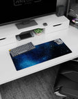 Space night scene mouse pad 28x12 inches featuring scattered white stars and bright starburst sparkles.